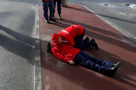 Members of firefighter school perform first aid exercises during a training session in Oliveira do Hospital, Portugal November 10, 2018. Picture taken November 10, 2018. REUTERS/Rafael Marchante