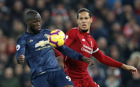 Soccer Football - Premier League - Liverpool v Manchester United - Anfield, Liverpool, Britain - December 16, 2018 Liverpool's Virgil van Dijk in action with Manchester United's Romelu Lukaku Action Images via Reuters/Carl Recine EDITORIAL USE ONLY. No use with unauthorized audio, video, data, fixture lists, club/league logos or "live" services. Online in-match use limited to 75 images, no video emulation. No use in betting, games or single club/league/player publications. Please contact your account representative for further details - Credit: Action Images