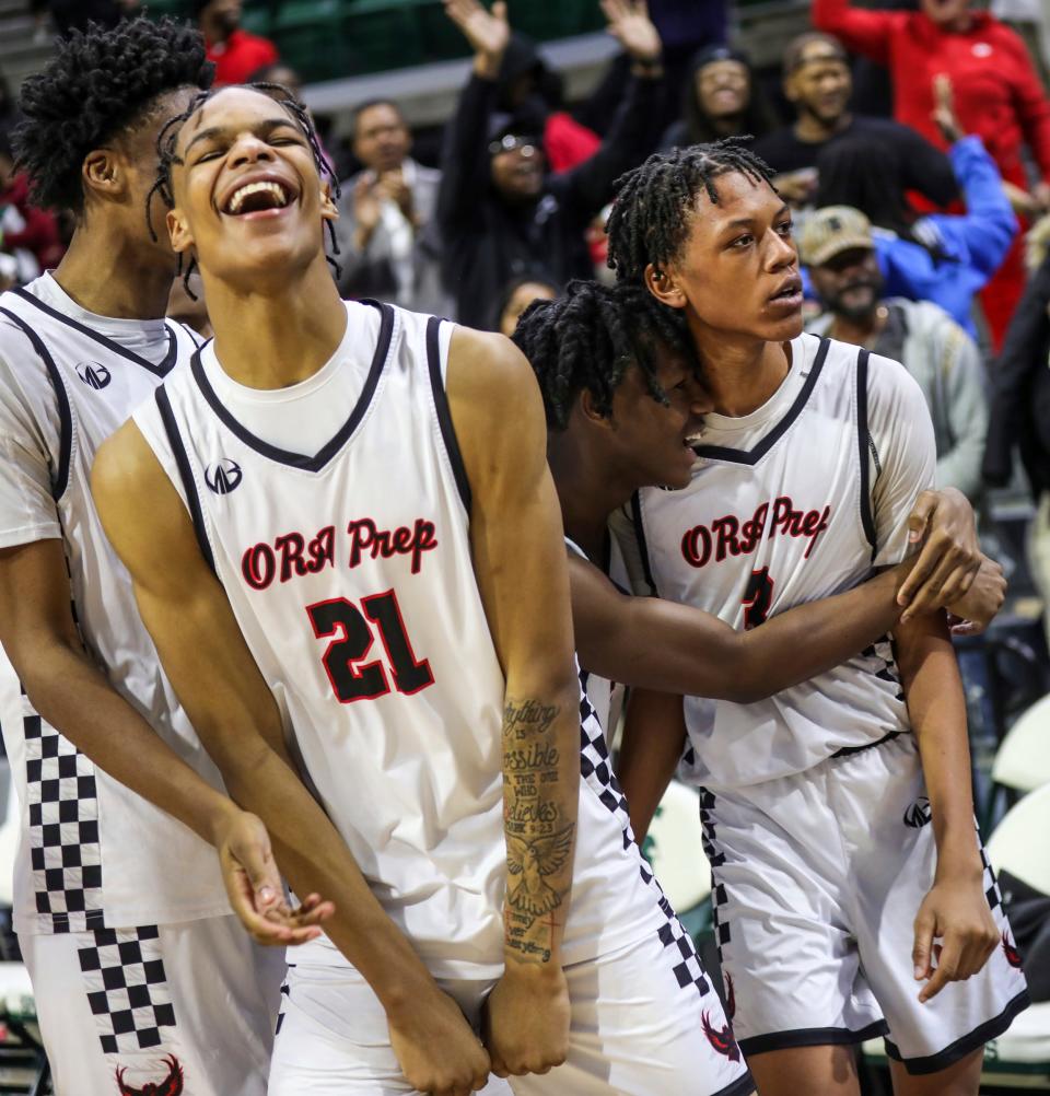 Detroit Old Redford celebrates its win against Riverview Gabriel Richard during the Michigan High School Athletic Association boys basketball Division 3 semifinals at Breslin Center in East Lansing on Thursday, March 14, 2024.