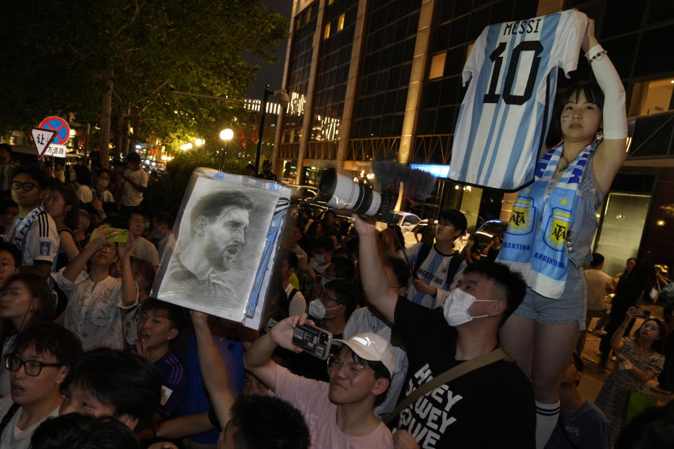 Chinese fans wait to catch a glimpse of the soccer superstar Lionel Messi in Beijing, Tuesday, June 13, 2023. Argentina is scheduled to play Australia in a friendly match in China's capital on Thursday. (AP Photo/Ng Han Guan)