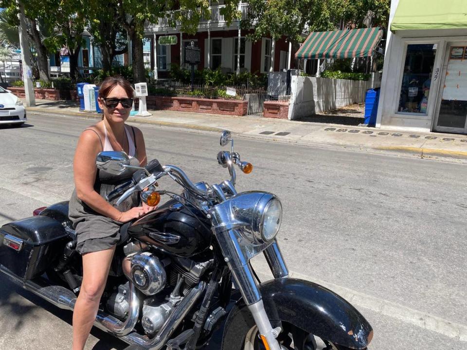 Lynn Lydamore, of Key West, greeted friends on Duval Street on Monday, March 23, 2020, after running an errand.