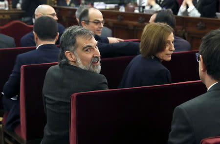 Catalan separatist leaders Jordi Cuixart and Carme Forcadell appear in court at the start of their trial at Supreme Court in Madrid, Spain, February 12, 2019. J.J. Guillen/Pool via REUTERS