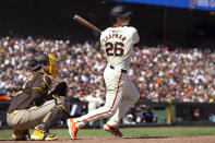 San Francisco Giants third baseman Matt Chapman (26) follows through on his RBI single against the San Diego Padres during the eighth inning of a baseball game, Sunday, April 7, 2024, in San Francisco. (AP Photo/D. Ross Cameron)