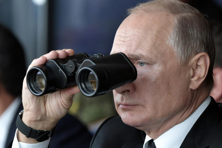 FILE - Russian President Vladimir Putin holds binoculars while watching the military exercises Center-2019 at Donguz shooting range near Orenburg, Russia, on Sept. 20, 2019. Russia's present demands are based on Putin's purported long sense of grievance and his rejection of Ukraine and Belarus as truly separate, sovereign countries but rather as part of a Russian linguistic and Orthodox motherland. (Alexei Nikolsky, Sputnik, Kremlin Pool Photo via AP, File)