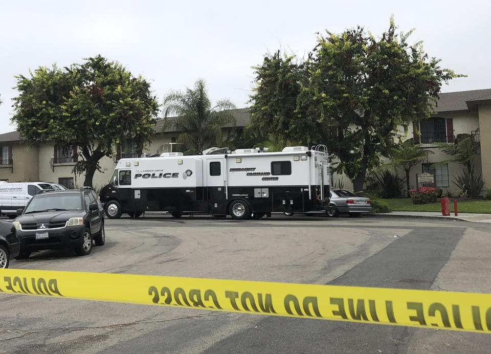 Garden Grove police work at the scene of a stabbing in Garden Grove, Calif., Thursday., Aug. 8, 2019. A man killed four people and wounded two in a string of robberies and stabbings in California's Orange County before he was arrested, police said Wednesday. (AP Photo/Amy Taxin)