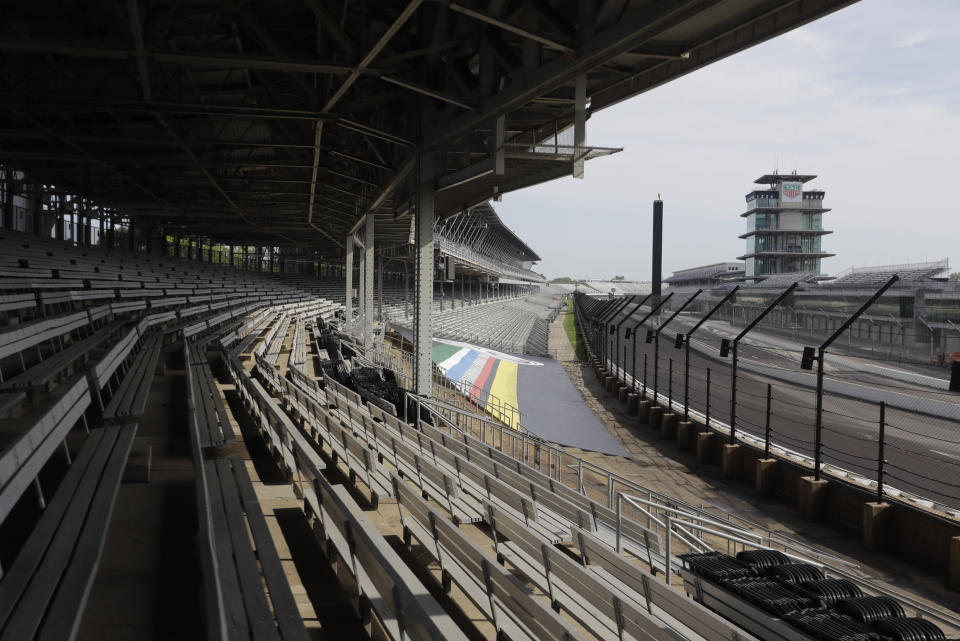 Indianapolis Motor Speedway is empty, Sunday, May 24, 2020, in Indianapolis. The Indianapolis 500 was postponed because of the coronavirus pandemic. The race will instead be held Aug. 23, three months later than its May 24 scheduled date. (AP Photo/Darron Cummings)