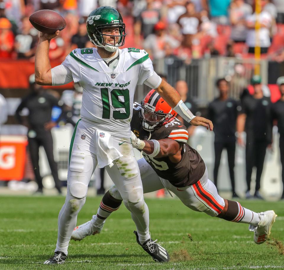 New York Jets quarterback Joe Flacco gets off a late fourth-quarter pass as Browns defensive end Myles Garrett is in pursuit Sunday, Sept. 18, 2022 in Cleveland.