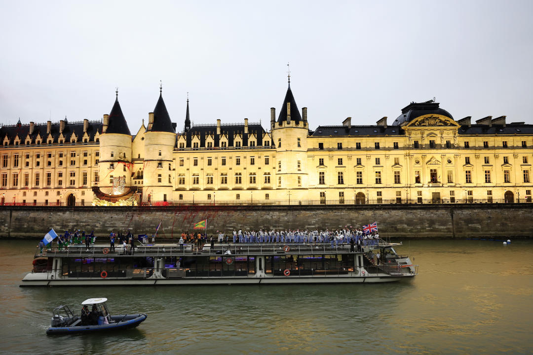 PARIS, FRANCE - JULY 26: Team Great Britain, Team Guinea-Bissau, Equatorial Guinea and Team Guyana cruise on the River Seine during the athletes’ parade during the opening ceremony of the Olympic Games Paris 2024 on July 26, 2024 in Paris, France. (Photo by Buda Mendes/Getty Images)