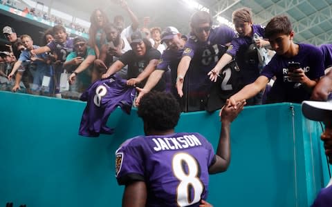 Baltimore Ravens quarterback Lamar Jackson (8) is cheered by fans as he exits the field, at the end of an NFL football game, Sunday, Sept. 8, 2019, in Miami Gardens, Fla. The Ravens defeated the Dolphins 59-10 - Credit: AP