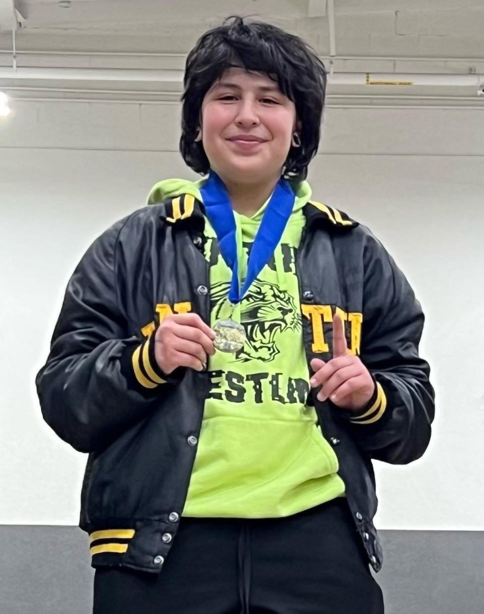 Ventura High's Bella Smith poses with her medal after winning the 143-pound title at the CIF-Southern Section Central Division Girls Wrestling Individuals on Saturday at Canyon Springs High.