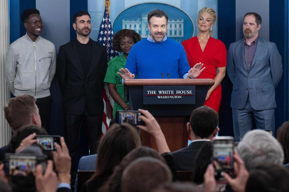English actor Toheeb Jimoh, British actor Brett Goldstein, White House Press Secretary Karine Jean-Pierre, English actress Hannah Waddingham, and US actor Brendan Hunt look on as US actor Jason Sudeikis speaks during the daily briefing in the James S Brady Press Briefing Room of the White House in Washington, DC, on March 20, 2023. - The cast of Ted Lasso is meeting with US President Joe Biden today to discuss the importance of addressing mental health to promote overall well-being. (Photo by SAUL LOEB / AFP) (Photo by SAUL LOEB/AFP via Getty Images)