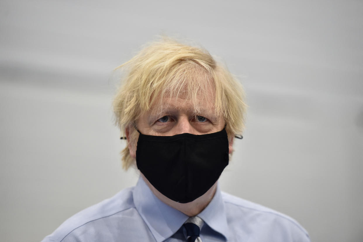 Britain's Prime Minister Boris Johnson tours the Lakeland Forum Covid-19 vaccination centre on March 12, 2021 in Enniskillen, Northern Ireland. (Photo by Charles McQuillan / POOL / AFP) (Photo by CHARLES MCQUILLAN/POOL/AFP via Getty Images)