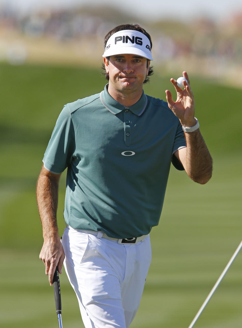 Bubba Watson waves to the gallery after making his putt on the ninth green during the third round of the Phoenix Open golf tournament Saturday, Feb. 1, 2014, in Scottsdale, Ariz. (AP Photo/The Arizona Republic, David Kadlubowski ) MARICOPA COUNTY OUT; MAGS OUT; NO SALES