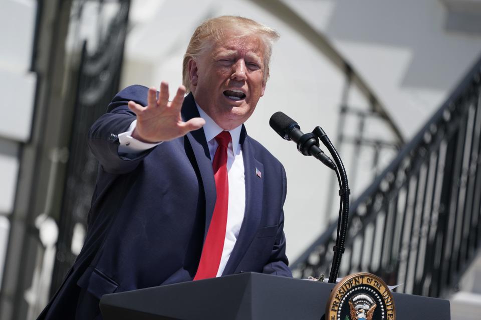 President Donald Trump takes questions from reporters at the White House Monday.