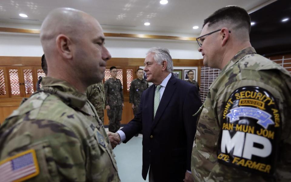 U.S. Secretary of State Rex Tillerson, center, meets with U.S. and South Korea soldiers before the lunch meeting at the Camp Bonifas near the border village of Panmunjom, which has separated the two Koreas since the Korean War, in Paju, South Korea, Friday, March 17, 2017. (AP Photo/Lee Jin-man, Pool)