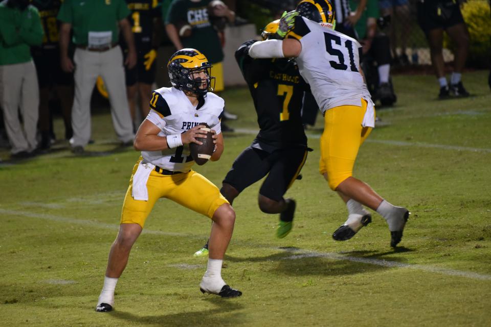 Prince Avenue Christian senior quarterback Aaron Philo drops back to pass during the team's 56-20 win at Pensacola Catholic after throwing five touchdown passes Friday night.