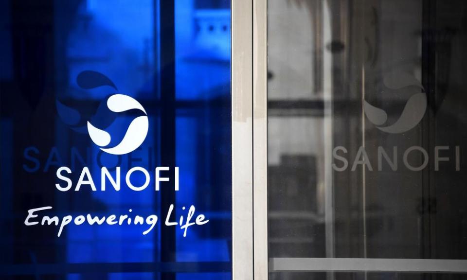 Photograph of the Sanofi corporate logo on blue glass at the company's HQ.