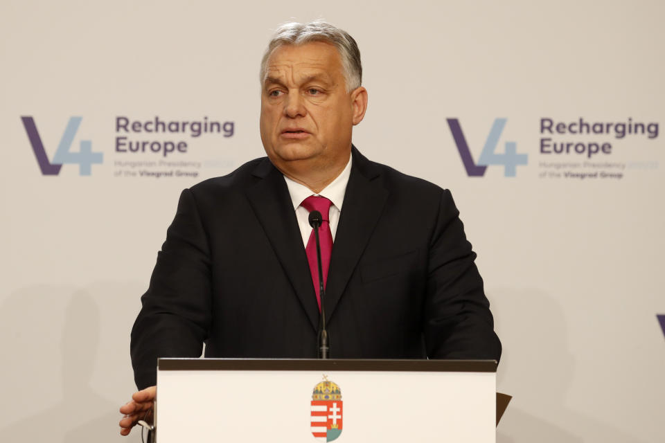 Hungary's Prime Ministers Viktor Orban addresses media at a news briefing in Budapest, Hungary, Tuesday, Nov. 23, 2021. The leaders of the Visegrad Four group of Central European countries met in Hungary's capital of Budapest Tuesday to discuss the ongoing migration crisis along Poland's border with Belarus. (AP Photo/Laszlo Balogh)