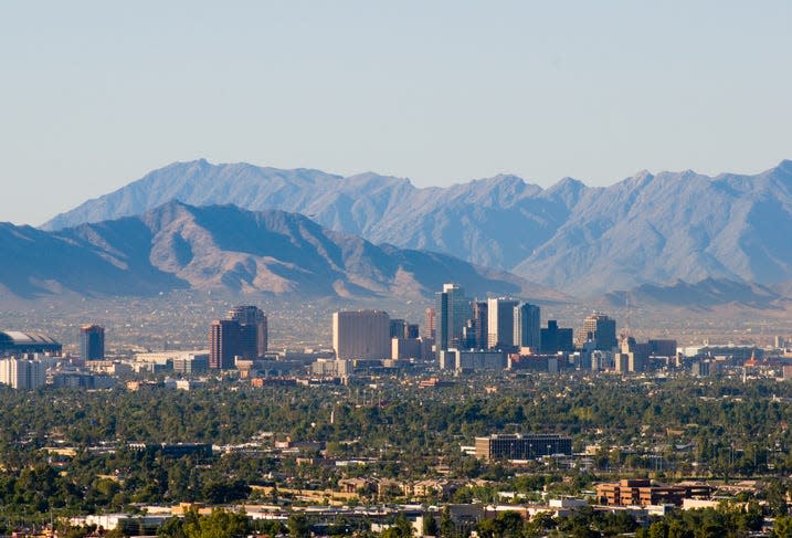 Downtown Phoenix skyline with the South and Sierra Estrella mountain ranges in the background