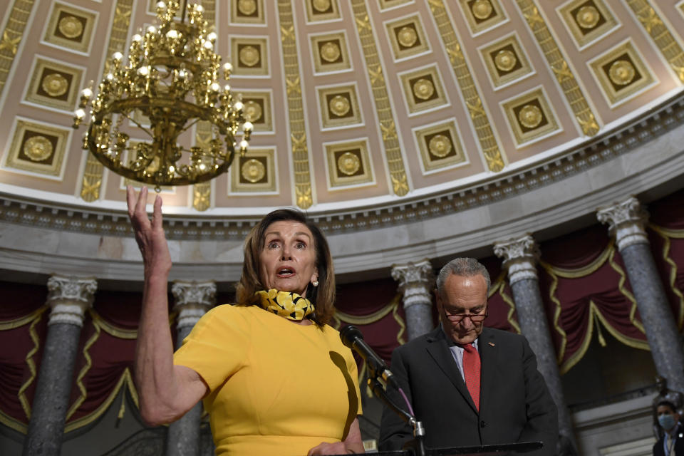 House Speaker Nancy Pelosi of Calif., left, speaks as she stands next to Senate Minority Leader Sen. Chuck Schumer of N.Y., right, on Capitol Hill in Washington, Monday, Aug. 3, 2020. Schumer and Pelosi met earlier with Treasury Secretary Steven Mnuchin and White House Chief of Staff Mark Meadows as they continue to negotiate a coronavirus relief package. (AP Photo/Susan Walsh)