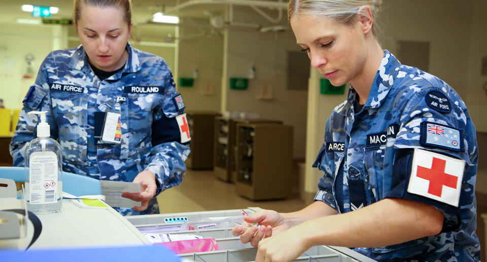 A supplied image obtained on Saturday, April 18, 2020, shows Royal Australian Air Force Medical Technician, Corporal Megan Macauslan, carrying out a check on the Emergency Trolley in the North West Regional Hospital in Burnie, Tasmania, after the hospital's formal handover from contracted cleaning personnel, during COVID-19. (AAP Image/Supplied by Department of Defence) NO ARCHIVING, EDITORIAL USE ONLY