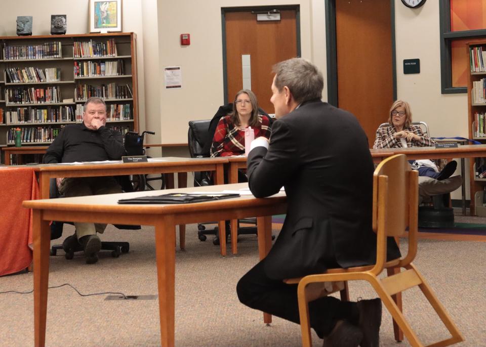 Tecumseh school board members, from left, Tim Simpson, Becky Brooks and Mary Tommelein listen to Rodney Green of the Michigan Association of School Boards as he talks with the school board about the candidate profile for the school district's next superintendent at a meeting Wednesday, Jan. 31, 2024, at Tecumseh High School.