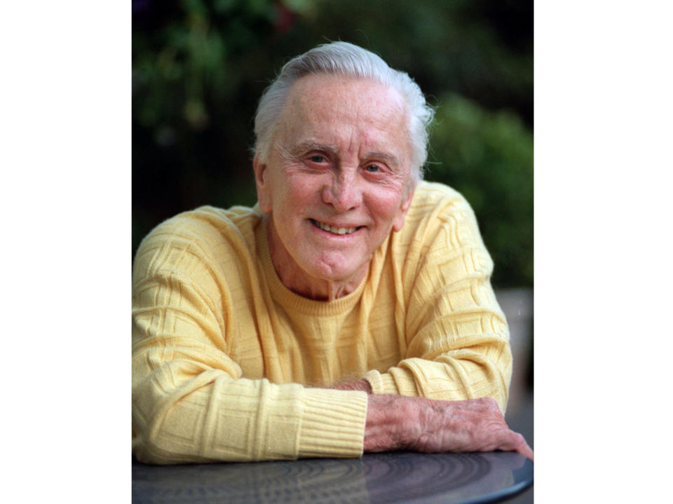 FILE - This Jan. 21, 1999 file photo shows actor Kirk Douglas at his home in Beverly Hills, Calif. Kirk Douglas died Wednesday, Feb. 5, 2020 at age 103. Douglas died Wednesday, Feb. 5, 2020 at age 103. (AP Photo/Reed Saxon, File)