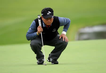 K.J. Choi lines up his putt on the eighteenth hole green during the third round of the Farmers Insurance Open golf tournament at Torrey Pines Municipal Golf Course - South Course. Gary A. Vasquez-USA TODAY Sports