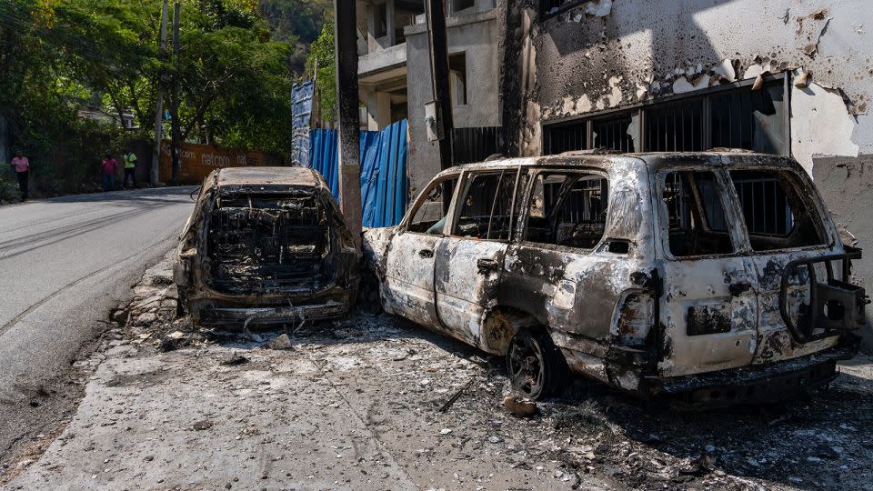 Burned out vehicles on the streets of Port-au-Prince. - Evelio Contreras/CNN