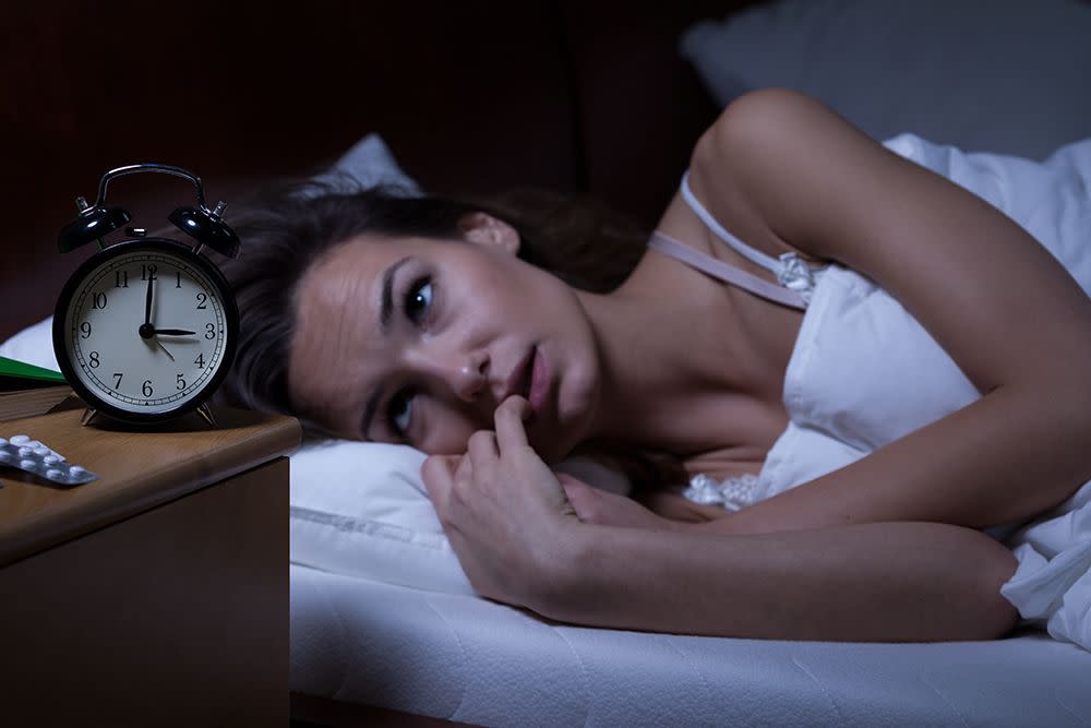 woman lying awake in bed