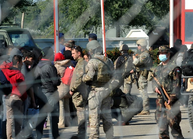 Hungarian military and police stand guard at the Croatian -Hungarian border crossing in village of Baranjsko Petrovo Selo in village of Baranjsko Petrovo Selo, near the North-Eastern Croatian town of Beli Manastir, on October 2, 2015