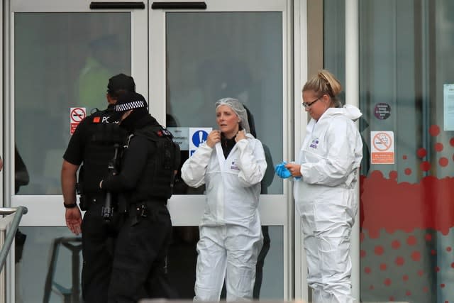 Police and forensic officers outside the shopping centre