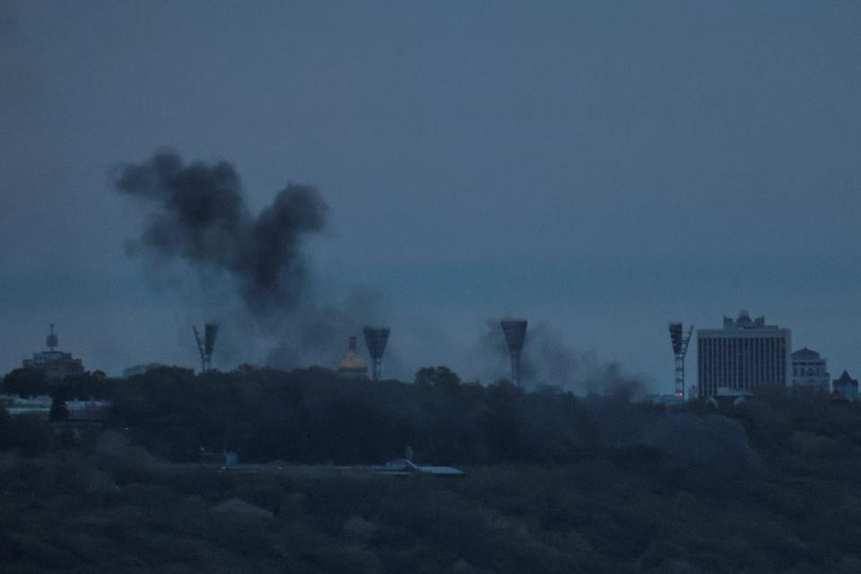 Smoke rises over the city after remains of a shot down drone landed on buildings, amid Russia's attack on Ukraine, in Kyiv, Ukraine May 4, 2023.