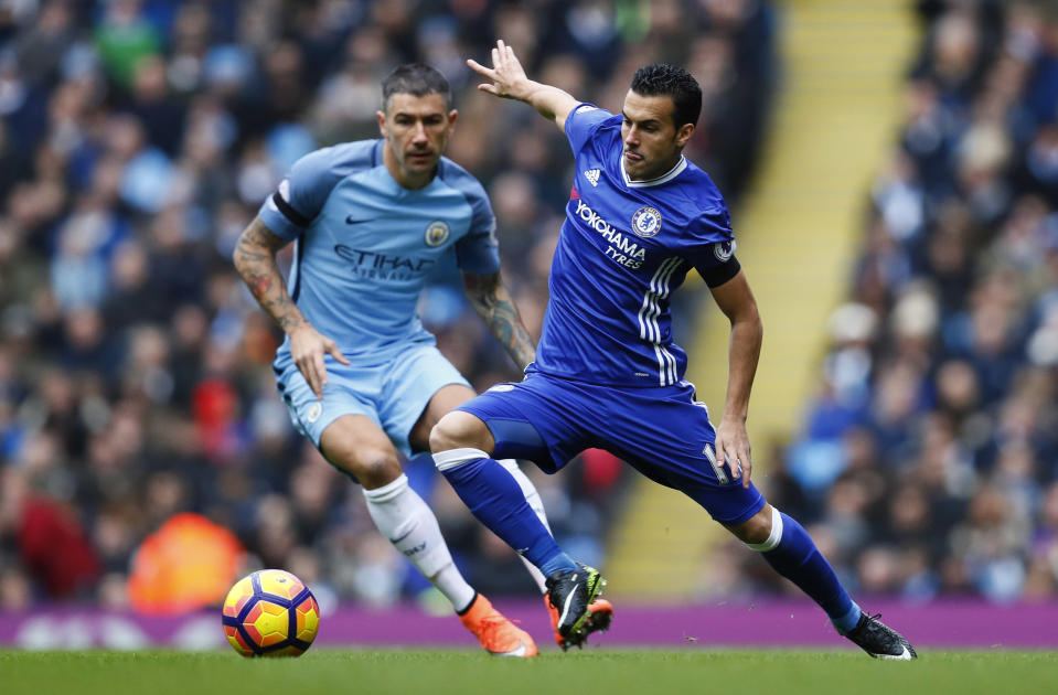 Britain Football Soccer - Manchester City v Chelsea - Premier League - Etihad Stadium - 3/12/16 Chelsea's Pedro in action with Manchester City's Aleksandar Kolarov Action Images via Reuters / Jason Cairnduff Livepic EDITORIAL USE ONLY. No use with unauthorized audio, video, data, fixture lists, club/league logos or "live" services. Online in-match use limited to 45 images, no video emulation. No use in betting, games or single club/league/player publications. Please contact your account representative for further details.