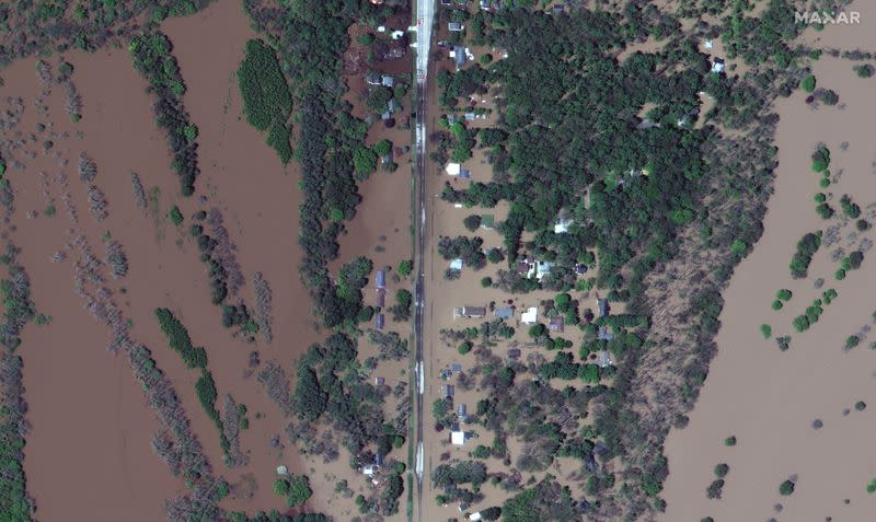 A satellite image shows the flooded Isabella Street and homes after rising floodwaters unleashed by two dam failures submerged parts of Midland, Michigan