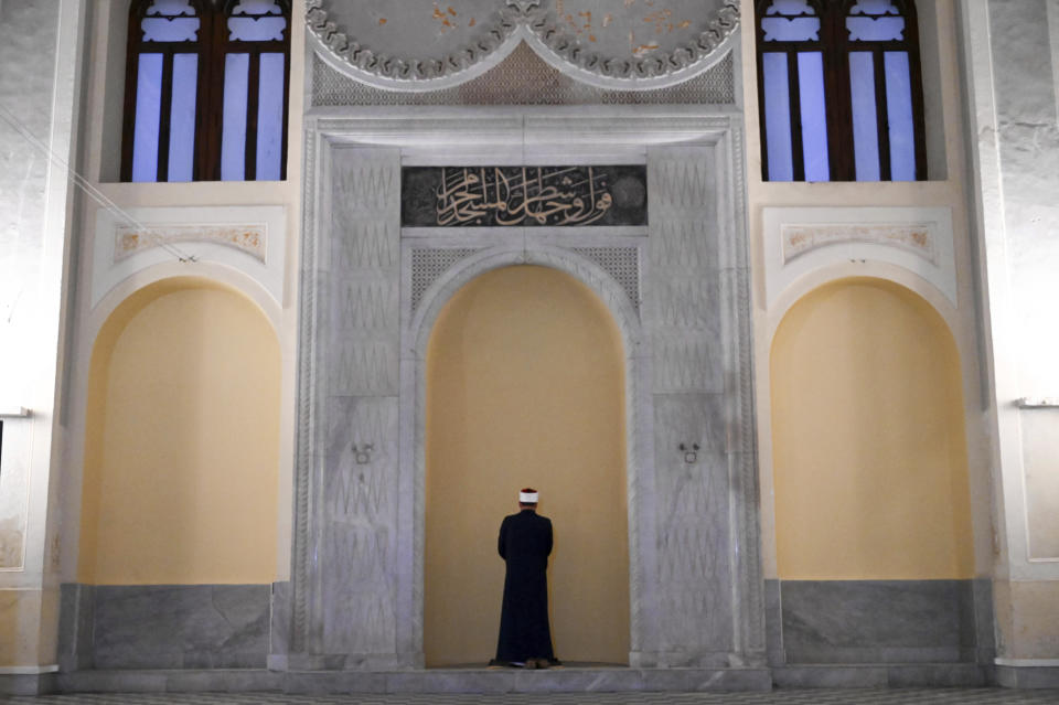 Taha Abdelgalil, the imam who leads the prayer, stands at the historic Yeni Cami, or New Mosque, in the port city of Thessaloniki, northern Greece, Wednesday, April 10, 2024. Eid prayers held in the historic former mosque in northern Greece for the first time in 100 years. (AP Photo/Giannis Papanikos)