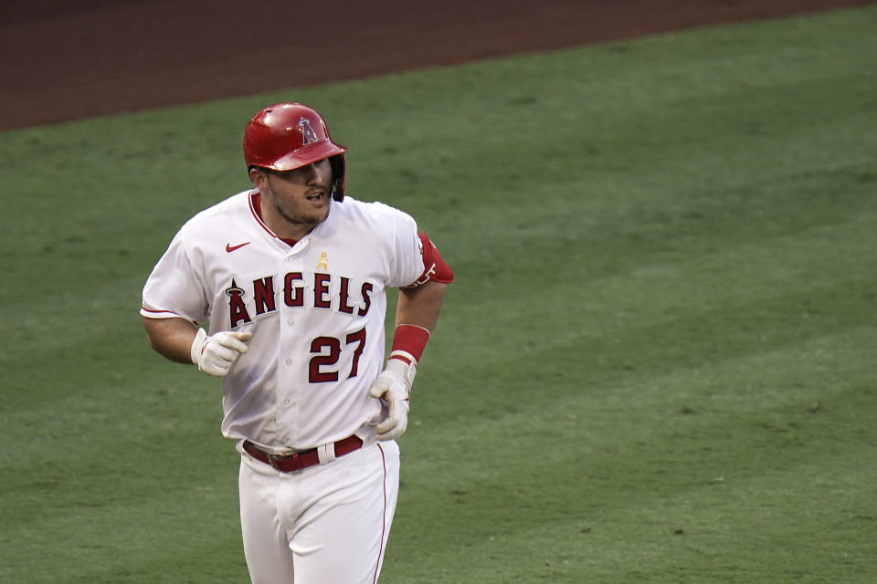 Los Angeles Angels' Mike Trout rounds the bases after hitting a two-run home run during the third inning of the first baseball game of a doubleheader against the Houston Astros, Saturday, Sept. 5, 2020, in Anaheim, Calif. (AP Photo/Jae C. Hong)