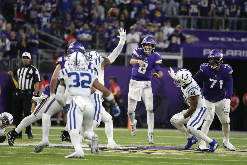 Minnesota Vikings quarterback Kirk Cousins (8) throws a pass during overtime in an NFL football game against the Indianapolis Colts, Saturday, Dec. 17, 2022, in Minneapolis. The Vikings won 39-36. (AP Photo/Andy Clayton-King)