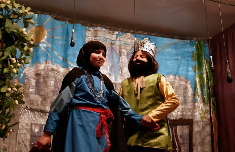 Syrian girls act in an English-language adaptation of "Snow White and the Seven Dwarfs" at a school in the rebel-held town of Douma, on the eastern outskirts of Damascus