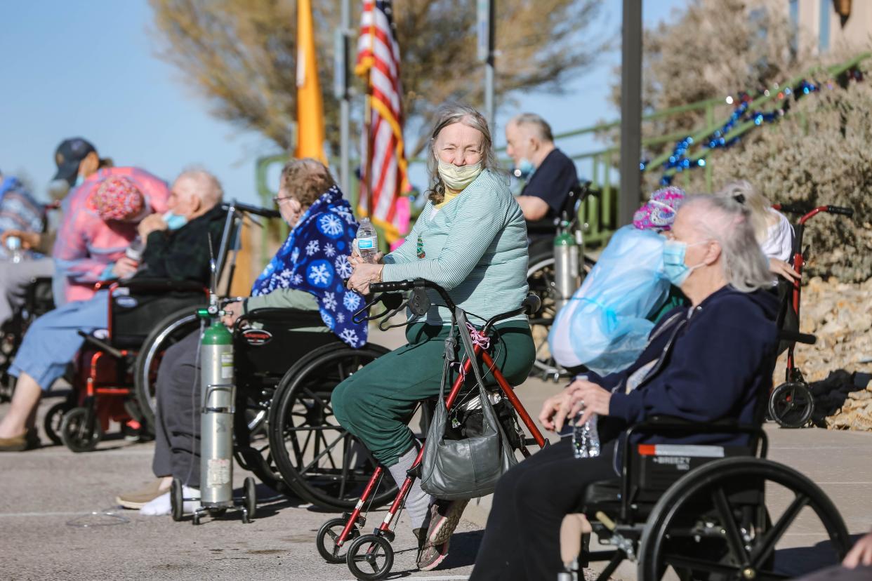 Patients at the Haciendas at Grace Village assisted living facility in Las Cruces are treated to a law enforcement car parade on Tuesday, Dec. 8, 2020.