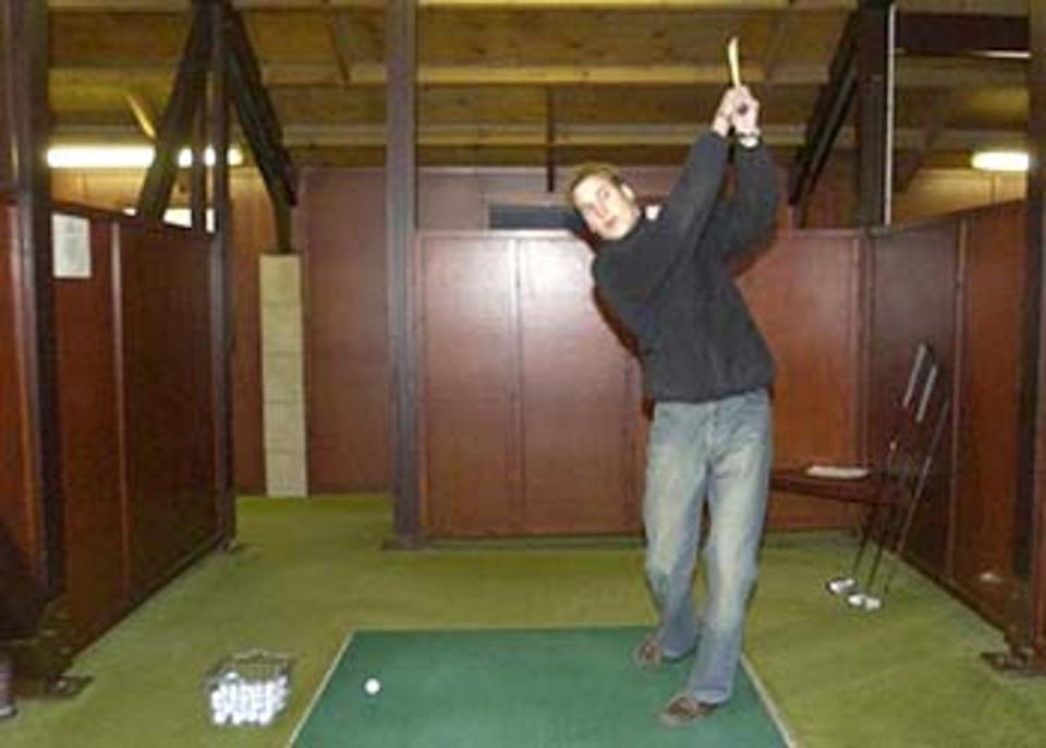 Swing when you're winning: Prince William practises his golf swing<br></br>Â© PA: 