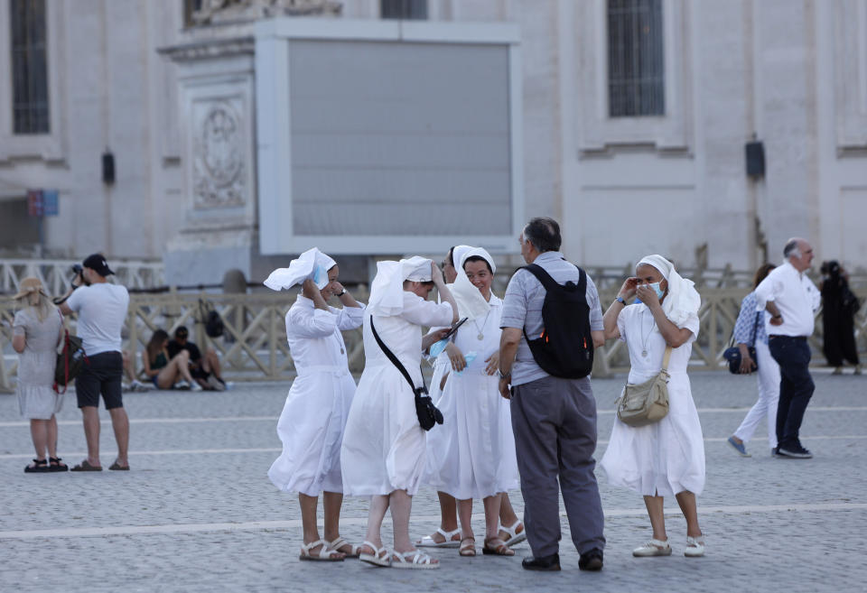 A group of nuns stand in St. Peter's Square at the Vatican, Sunday, July 4, 2021. Pope Francis was hospitalized in Rome on Sunday afternoon for scheduled surgery on his large intestine, the Vatican said. The news came just three hours after Francis had cheerfully greeted the public in St. Peter’s Square and told them he will go to Hungary and Slovakia in September. (AP Photo/Riccardo De Luca)