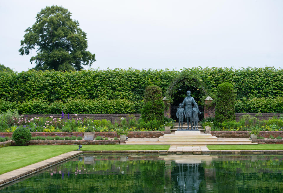 LONDON, ENGLAND - JULY 01: The statue of Diana, Princess of Wales, by artist Ian Rank-Broadley, in the Sunken Garden at Kensington Palace. The bronze statue depicts the princess surrounded by three children to represent the 