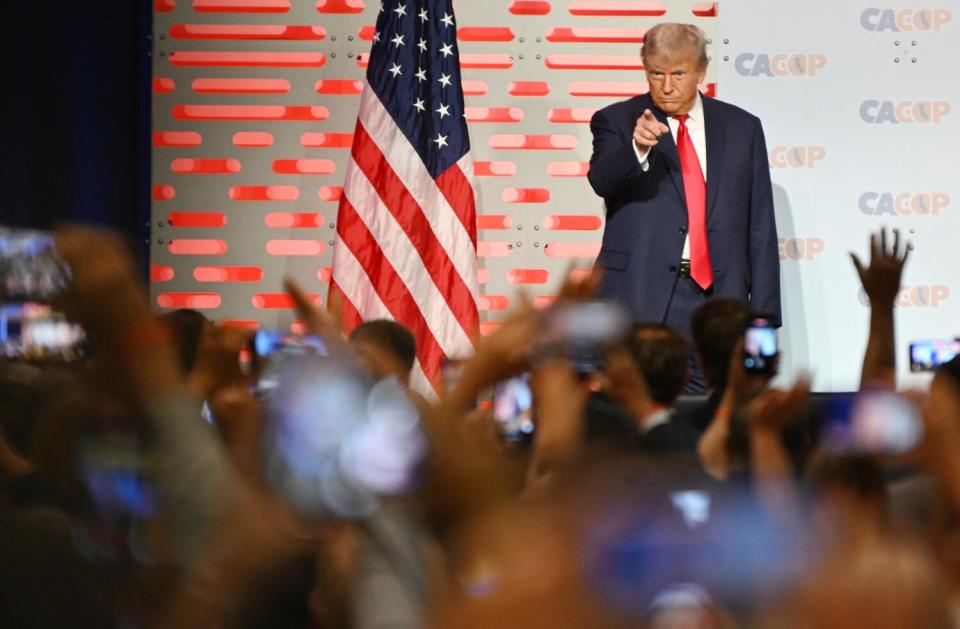 Former U.S. President Donald Trump takes the stage during the California Republican Convention in Anaheim.