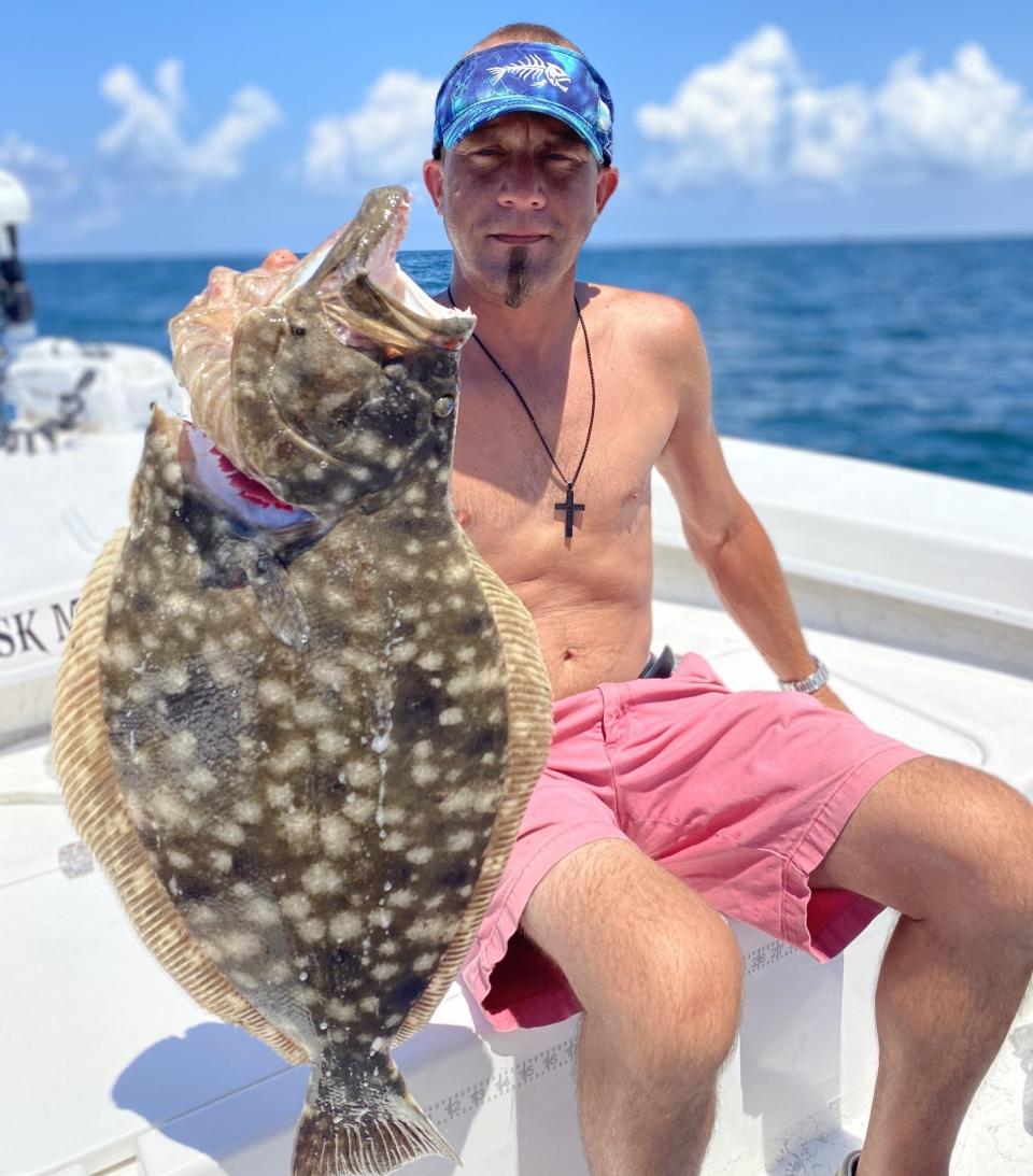 Eric Poulos, visiting from South Carolina, used a mudminnow to bring this 8-pound flounder to Capt. Jeff Patterson's Pole Dancer charter boat.