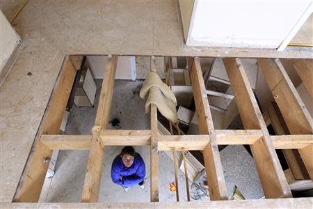 Rhoda Brogan walks around the show home which neighbours her own home, on the Glenall housing estate in the village of Borris-in-Ossory, County Laois, Ireland February 13, 2013. REUTERS/Cathal McNaughton