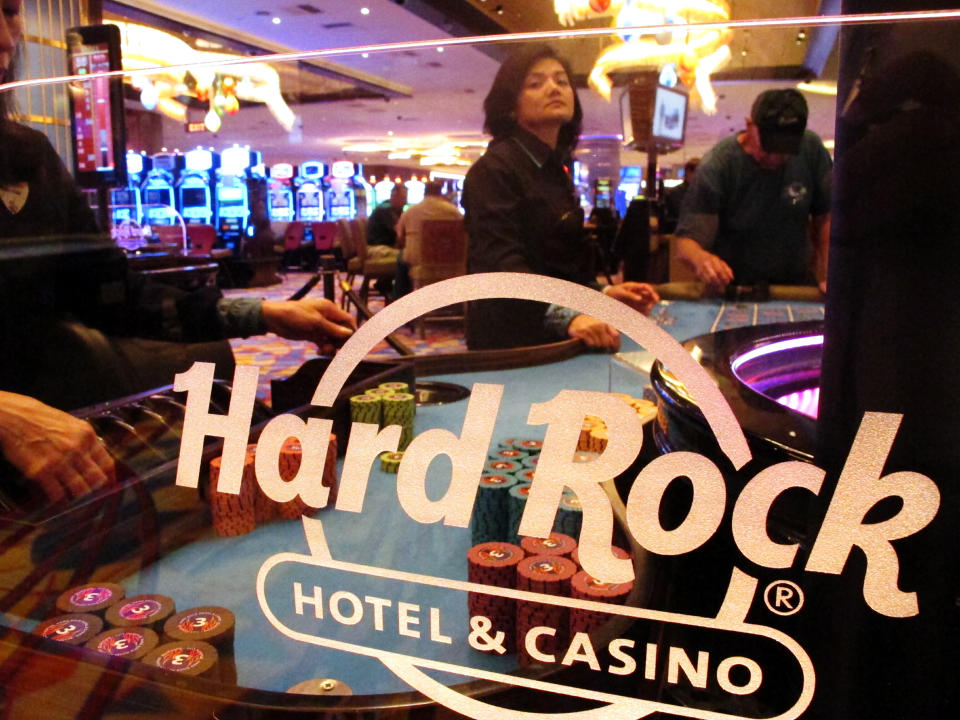 In this June 20, 2019 photo, a roulette dealer waits for bets to be placed at the Hard Rock casino in Atlantic City, N.J. The Ocean and Hard Rock casinos both reopened on June 27, 2018, and are fighting for business in the expanded Atlantic City gambling market. (AP Photo/Wayne Parry)