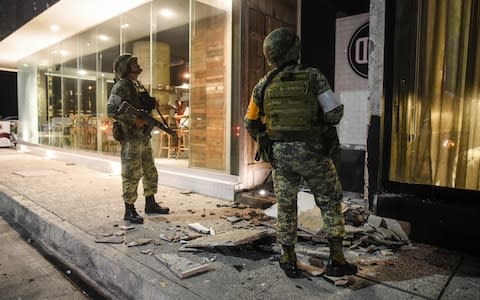 Members of the Mexican army look at damage caused by an earthquake in the Port of Veracuz on September 7,  - Credit: VICTORIA RAZO