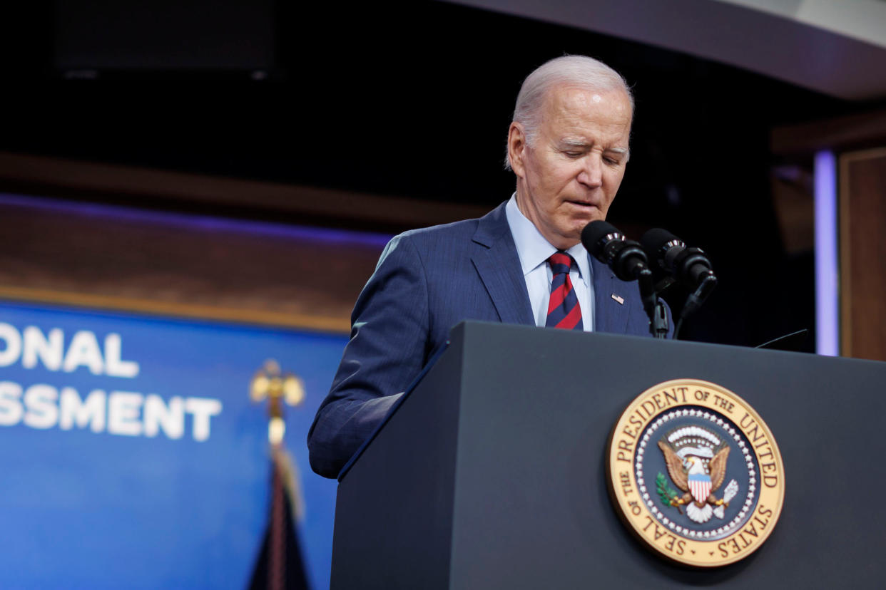 President Biden stands at a podium.