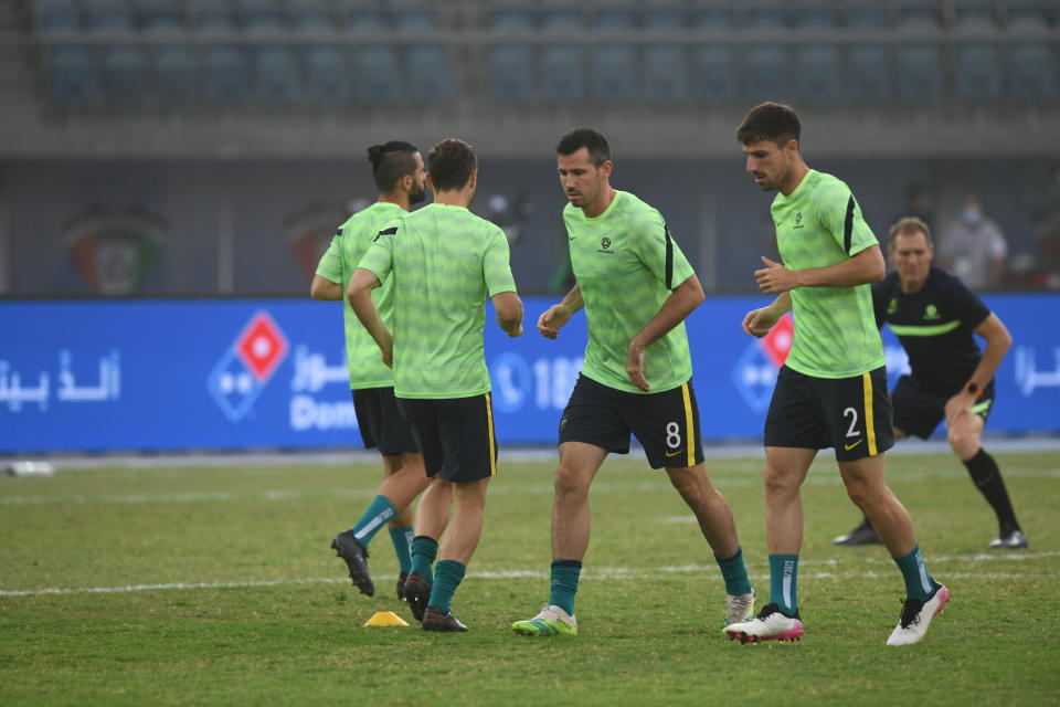 fight for the ball during the World Cup 2022 Group B qualifying soccer match between Nepal and Australia in Kuwait City, Kuwait, Friday. June 11, 2021. (AP Photo/Jaber Abdulkhaleg)